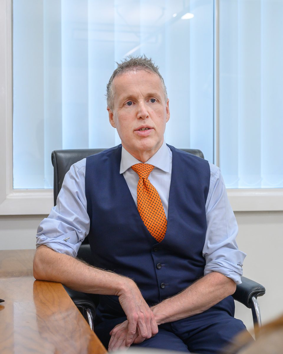 Mr Christopher Vinall talking with a patient