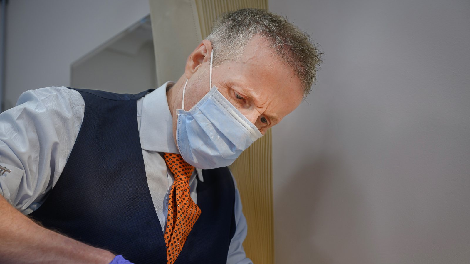 Mr Christopher Vinall examining a patient