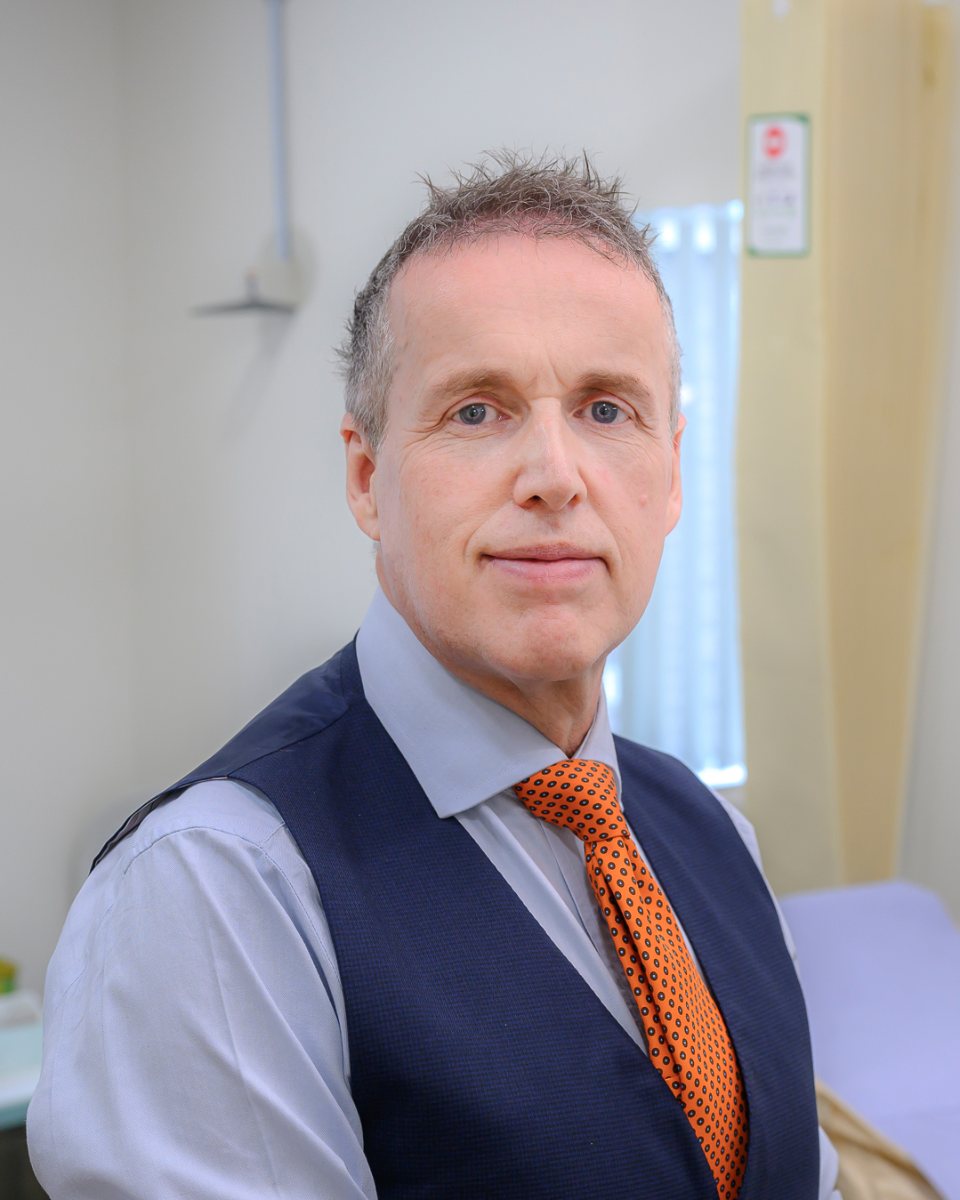 Mr Christopher Vinall in his consulting room